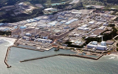 FILE - This aerial view shows the Fukushima Daiichi nuclear power plant, situated in coastal towns of both Okuma and Futaba, northeastern Japan, on Aug. 24, 2023, shortly after its operator Tokyo Electric Power Company Holdings TEPCO began releasing its first batch of treated radioactive water into the Pacific Ocean. Japan said Sunday, March 31, 2024, its experts have held talks with their Chinese counterparts to try to assuage Beijing’s concerns over the discharge of treated radioactive wastewater from the wrecked Fukushima Daiichi nuclear power plant into the sea. (Kyodo News via AP, File)