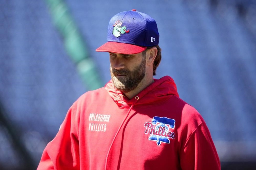 Philadelphia Phillies' Bryce Harper walks the field during batting practice before an opening-day baseball game against the Atlanta Braves, Friday, March 29, 2024, in Philadelphia. (AP Photo/Matt Slocum)