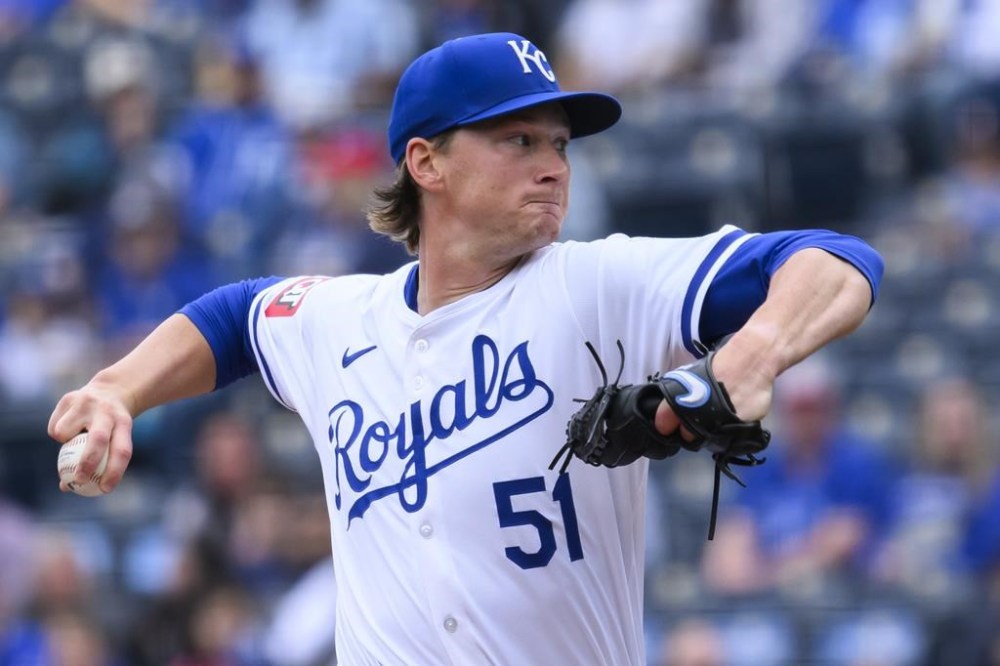 Kansas City Royals starting pitcher Brady Singer throws to a Minnesota Twins batter during the first inning of a baseball game Sunday, March 31, 2024, in Kansas City, Mo. (AP Photo/Reed Hoffmann)