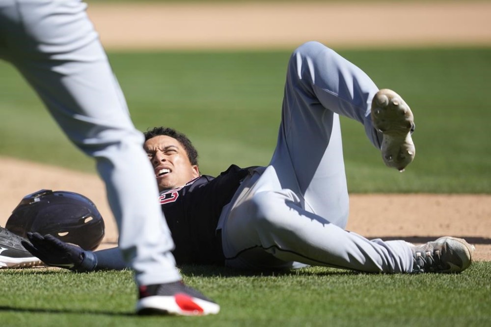 Cleveland Guardians' Bo Naylor reacts as he is called out after being picked off third base during the ninth inning of a baseball game against the Oakland Athletics in Oakland, Calif., Sunday, March 31, 2024. (AP Photo/Jeff Chiu)