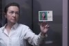 Alsu Kurmasheva, an editor for the U.S. government-funded Radio Free Europe/Radio Liberty's Tatar-Bashkir service, holds a card depicting her portrait and with a sign in Russian that reads