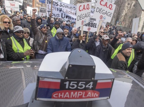 A trial begins Tuesday in a class-action lawsuit brought by former holders of Quebec taxi permits who allege the provincial government effectively expropriated their property without proper compensation when it abolished those permits. Quebec taxi drivers protest against new legislation to deregulate the industry, in Montreal, Friday, April 5, 2019. THE CANADIAN PRESS/Ryan Remiorz