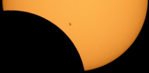 FILE - In this image made available by NASA, the International Space Station is silhouetted against the sun during a solar eclipse Monday, Aug. 21, 2017, as seen from Ross Lake, Northern Cascades National Park in Washington state. Inmates in New York are suing the state corrections department over the decision to lock down prisons during the total solar eclipse, Monday, April 8, 2024. (Bill Ingalls/NASA via AP, File)
