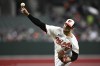 Baltimore Orioles starting pitcher Dean Kremer throws during the first inning of a baseball game against the Kansas City Royals, Monday, April 1, 2024, in Baltimore. (AP Photo/Nick Wass)