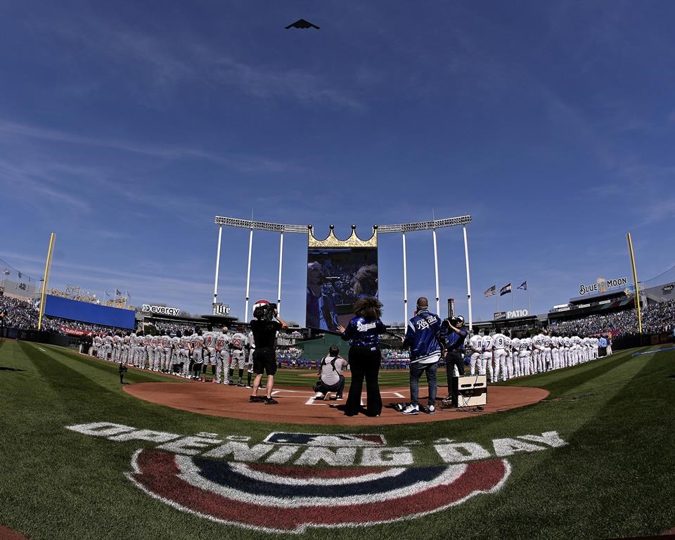 An Air Force B2 bomber flies over Kauffman Stadium before a baseball game between the Kansas City Royals and the Minnesota Twins Thursday, March 28, 2024, in Kansas City, Mo. (AP Photo/Charlie Riedel)