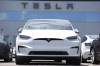 FILE - An Unsold 2023 Model X sports-utility vehicle sits outside a Tesla dealership Sunday, June 18, 2023, in Englewood, Colo. Tesla sales are expected to fall in the first quarter as demand for electric vehicles continues to slow. (AP Photo/David Zalubowski, File)