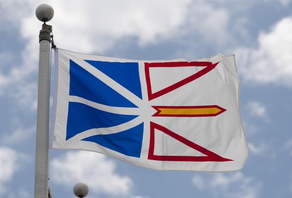 Newfoundland and Labrador's provincial flag flies on a flagpole in Ottawa, Friday July 3, 2020. A truck caught in a landslide in western Newfoundland in the early hours of Tuesday narrowly avoided disaster. Todd Flynn, director of protective services for the City of Corner Brook, says the truck carrying two people was