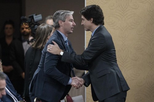 Prime Minister Justin Trudeau, right, is greeted by Nova Scotia Premier Tim Houston in Truro, N.S., on Thursday, March 30, 2023. Nova Scotia’s premier has responded to a challenge from the prime minister to submit an alternative to the federal carbon pricing program. THE CANADIAN PRESS/Darren Calabrese