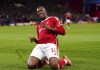 Nottingham Forest's Callum Hudson-Odoi celebrates scoring the opening goal during the English Premier League soccer match between Nottingham Forest and Fulham at the City Ground, in Nottingham, England, Tuesday, April 2, 2024. (Bradley Collyer/PA via AP)