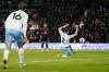 Crystal Palace's Joel Ward, right, fails to stop Bournemouth's Justin Kluivert, second left, from scoring the opening goal during the English Premier League soccer match between Bournemouth and Crystal Palace at the Vitality Stadium, Bournemouth, England, Tuesday, April 2, 2024. (Andrew Matthews/PA via AP)