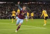 Burnley's Jacob Bruun Larsen celebrates scoring the opening goal during the English Premier League soccer match between Burnley and Wolverhampton Wanderers at Turf Moor, Burnley, England, Tuesday, April 2, 2024. (Martin Rickett/PA via AP)