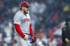 Cincinnati Reds starting pitcher Graham Ashcraft reacts to the out during the third inning of a baseball game against the Philadelphia Phillies, Tuesday, April 2, 2024, in Philadelphia. (AP Photo/Chris Szagola)