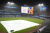 A tarp covers the infield after a scheduled baseball game between the Detroit Tigers and the New York Mets was postponed for inclement weather, Tuesday, April 2, 2024, in New York. (AP Photo/Frank Franklin II)