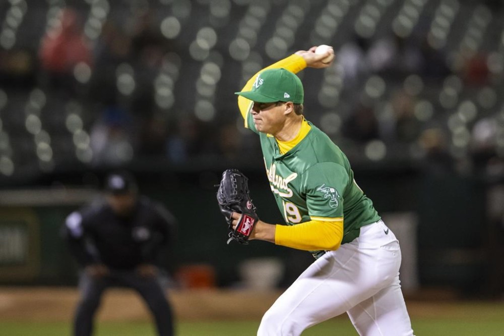 Oakland Athletics starting pitcher Mason Miller (19) pitches during the ninth inning of a baseball game against the Boston Red Sox, Tuesday, April 2, 2024, in Oakland, Calif. (AP Photo/Nic Coury)