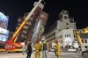Rescue workers stand near the site of a leaning building in the aftermath of an earthquake in Hualien, eastern Taiwan, on Wednesday, April 3, 2024. Taiwan's strongest earthquake in a quarter century rocked the island during the morning rush hour Wednesday, damaging buildings and highways. THE CANADIAN PRESS/AP-Johnson Lai