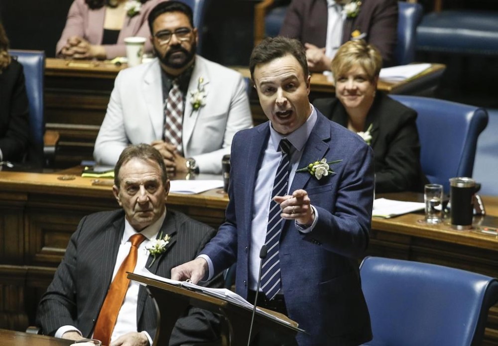 Manitoba Finance Minister Adrien Sala delivers the provincial budget in the Manitoba Legislature in Winnipeg, Tuesday, April 2, 2024.  THE CANADIAN PRESS/John Woods