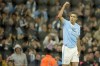 Manchester City's Rodrigo celebrates after scoring as seen through the goal net during the English Premier League soccer match between Manchester City and Aston Villa at the Etihad Stadium in Manchester, England, Wednesday, April 3, 2024. (AP Photo/Dave Thompson)