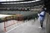 Charlie Slaybaugh of Kansas City, Mo., waits out a rain delay before a baseball game between the Baltimore Orioles and the Kansas City Royals, Wednesday, April 3, 2024, in Baltimore. (AP Photo/Nick Wass)