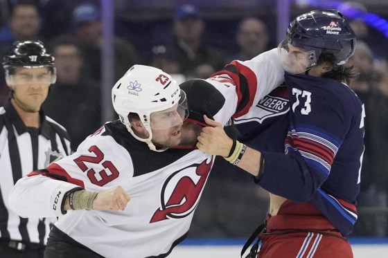 New Jersey Devils defenceman Kurtis MacDermid (23) fights New York Rangers centre Matt Rempe (73) Wednesday in New York. (Mary Altaffer / The Associated Press)