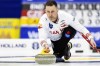 Canada's skip Brad Gushue delivers a stone against the Czech Republic at the men's Curling World Championships in Schaffhausen, Switzerland, Saturday, March 30, 2024. Gushue clinched a playoff spot with a 7-4 win over Magnus Ramsfjell of Norway at the world men's curling championship on Thursday. THE CANADIAN PRESS/AP-Michael Buholzer/Keystone via AP