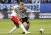 CF Montreal defender Robert Thorkelsson, right, is challenged by Vaughan SC's Emmanuel Zambazis during first half preliminary round Canadian Championship soccer action in Montreal, Tuesday, April 18, 2023. CF Montreal loaned Thorkelsson to second-division Norwegian club Kongsvinger IL Toppfotball on Thursday.THE CANADIAN PRESS/Graham Hughes
