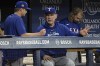 Texas Rangers manager Bruce Bochy, center, talks with a coach during the sixth inning of a baseball game against the Tampa Bay Rays Monday, April 1, 2024, in St. Petersburg, Fla. (AP Photo/Steve Nesius)
