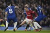 Manchester United's Antony, center, is challenged by Chelsea's Enzo Fernandez, left, and Chelsea's Moises Caicedo during the English Premier League soccer match between Chelsea and Manchester United at Stamford Bridge in London, Thursday, April 4, 2024. (AP Photo/Kin Cheung)
