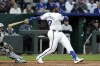 Kansas City Royals' Nelson Velázquez watches his solo home run during the fourth inning of a baseball game against the Chicago White Sox Thursday, April 4, 2024, in Kansas City, Mo. (AP Photo/Charlie Riedel)