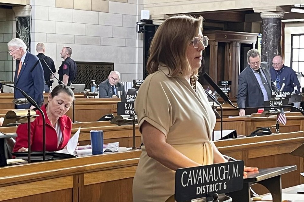 Nebraska state Sen. Machaela Cavanaugh, right, speaks on the floor of the Legislature against a bill to restrict transgender students' access to bathrooms and sports teams as the bill's author, Sen. Kathleen Kauth, left, takes notes Friday, April 5, 2024, in Lincoln, Neb. The bill failed to advance on Friday. (AP Photo/Margery Beck)