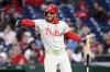 Philadelphia Phillies Bryce Harper gestures during his at-bat in the third inning of a baseball game against the Washington Nationals, Friday, April 5, 2024, in Washington. (AP Photo/Nick Wass)