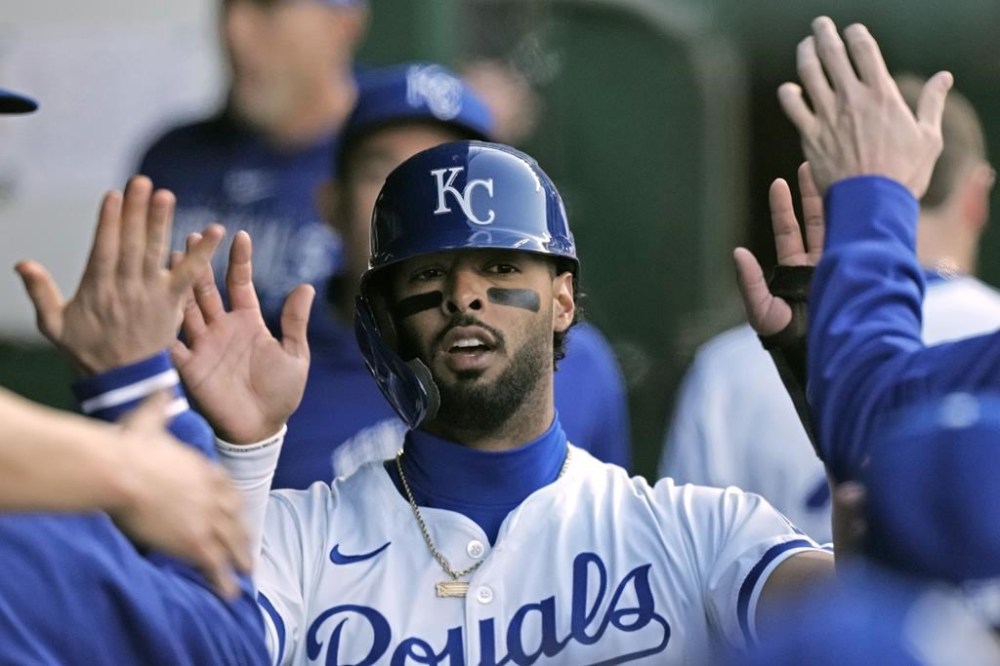 Kansas City Royals' MJ Melendez celebrates in the dugout after scoring on a single by Nelson Vel·zquez during the second inning of a baseball game against the Chicago White Sox Thursday, April 4, 2024, in Kansas City, Mo. (AP Photo/Charlie Riedel)