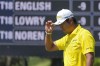 Hideki Matsuyama, of Japan, tips his cap to the gallery after putting out on the second green during the final round of The Players Championship golf tournament Sunday, March 17, 2024, in Ponte Vedra Beach, Fla. (AP Photo/Marta Lavandier)