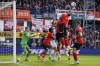 Luton Town's Teden Mengi heads the ball during the English Premier League soccer match between Luton and Bournemouth at Kenilworth Road, Luton, England, Saturday April 6, 2024. (Bradley Collyer/PA via AP)