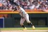 Oakland Athletics third baseman J.D. Davis throws out Detroit Tigers' Carson Kelly at first during the fifth inning of a baseball game, Saturday, April 6, 2024, in Detroit. (AP Photo/Carlos Osorio)