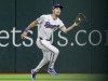 Texas Rangers right fielder Evan Carter catches a fly ball from Nico Hoerner during the seventh inning of a baseball game against the Chicago Cubs, Sunday, March 31, 2024, in Arlington, Texas. (AP Photo/Gareth Patterson)