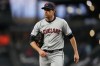 FILE - Cleveland Guardians starting pitcher Shane Bieber walks back to the dugout after throwing against the Seattle Mariners in a baseball game Tuesday, April 2, 2024, in Seattle. Cleveland's ace will have season-ending Tommy John elbow surgery, a major blow to the Guardians and the 2020 Cy Young winner, who had looked like his dominant self in two strong recent starts. (AP Photo/Lindsey Wasson, File)
