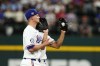 Texas Rangers shortstop Corey Seager, front, and second baseman Marcus Semien, rear, bump into each other as Semien catches a popup by Houston Astros' Jeremy Peña during the fourth inning of a baseball game in Arlington, Texas, Saturday, April 6, 2024. (AP Photo/Tony Gutierrez)