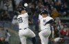 New York Yankees' Aaron Judge, left, greets Anthony Rizzo at the plate after Rizzo's two-run home run against the Toronto Blue Jays during the fifth inning of a baseball game Saturday, April 6, 2024, in New York. (AP Photo/John Munson)