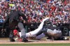 St. Louis Cardinals' Nolan Gorman, left, is tagged out at home by Miami Marlins catcher Nick Fortes (4) as home plate umpire Jeremie Rehak watches the play during the fourth inning of a baseball game Saturday, April 6, 2024, in St. Louis. (AP Photo/Jeff Roberson)