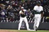 Colorado Rockies first baseman Elehuris Montero catches a throw from pitcher Jake Bird for the out on Tampa Bay Rays' Yandy Díaz during the seventh inning of a baseball game Saturday, April 6, 2024, in Denver. (AP Photo/Geneva Heffernan)