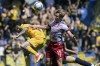 Bologna's Victor Kristiansen, right, and Frosinone's Matias Soule battle for the ball during the Italian Serie A soccer match between Frosinone and Bologna at the Benito Stirpe stadium, in Frosinone, Italy, Sunday, April 7, 2024 . (Alfredo Falcone/LaPresse via AP)