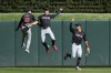 Cleveland Guardians left fielder Steven Kwan (38), right fielder Will Brennan and center fielder Tyler Freeman celebrate their win over the Minnesota Twins after a baseball game, Saturday, April 6, 2024, in Minneapolis. (AP Photo/Matt Krohn)