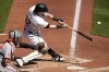 Pittsburgh Pirates' Henry Davis (32) hits a sacrifice fly off Baltimore Orioles pitcher Dean Kremer, driving in a run during the fifth inning of a baseball game in Pittsburgh, Sunday, April 7, 2024. (AP Photo/Gene J. Puskar)