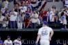 Texas Rangers relief pitcher Josh Sborz (66) walks off the field after striking out Chicago Cubs' Yan Gomes to end the seventh inning of a baseball game Thursday, March 28, 2024 in Arlington, Texas. (AP Photo/Gareth Patterson)