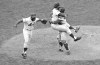 FILE - In this Oct. 16, 1969 file photo, New York Mets catcher Jerry Grote, right, embraces pitcher Jerry Koosman as Ed Charles, left, joins the celebration after the Mets defeated the Baltimore Orioles in the Game 5 to win the baseball World Series at New York's Shea Stadium. Grote, the catcher who helped transform the New York Mets from a perennial loser into the 1969 World Series champion, died Sunday, April 7, 2024. (AP Photo, File)