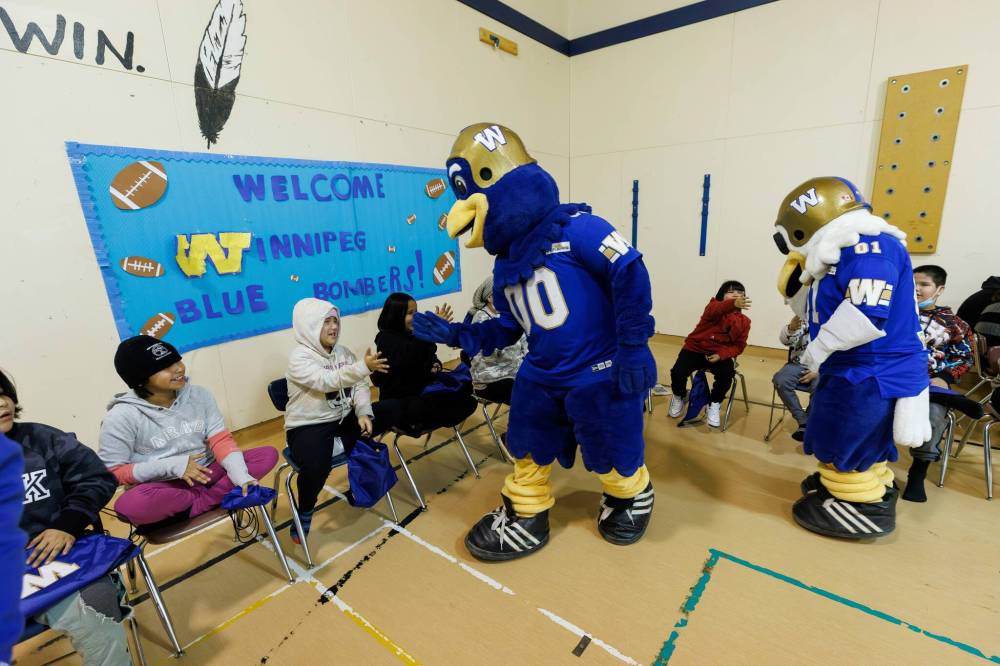MIKE DEAL / FREE PRESS
                                Bombers mascots Buzz and Boomer are always a hit wherever they go, including with the students at Red Sucker Lake Aninisinew Nation School.