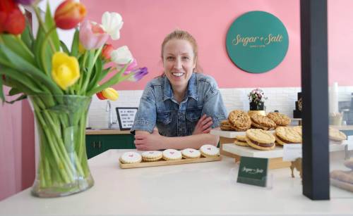 RUTH BONNEVILLE / FREE PRESS
                                Photo of Sugar + Salt owner, Kayla Milligan, with an array of her sweet treats.