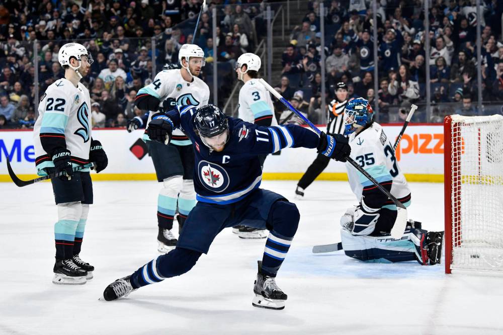 Fred Greenslade / THE CANADIAN PRESS
Winnipeg Jets’ Adam Lowry celebrates his goal on Seattle Kraken goaltender Joey Daccord during the second period.