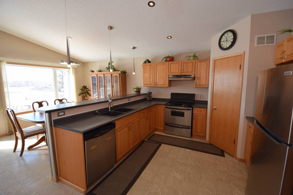 The bright, eat-in kitchen is filled with function.