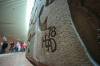 RUTH BONNEVILLE / FREE PRESS
                                The late Bruce Head’s signature adorns The Wall, the massive career-defining concrete artwork he created for the underground concourse at Portage and Main.